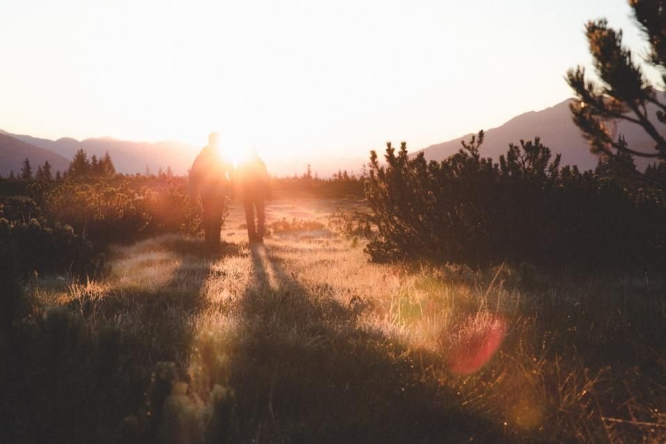 Two people walking together on a sunlit path – God leading a future husband and wife in His time